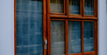 Wooden storefront with large glass windows, illustrating a Shopio review and store builder alternatives