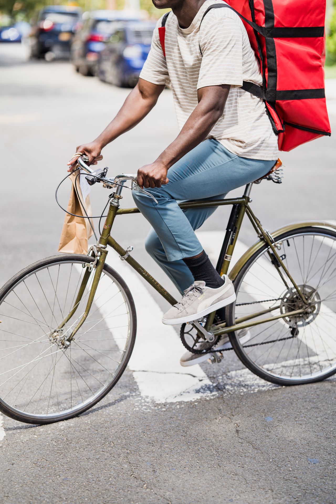 Food delivery rider on a bicycle, app-based gig work that pays weekly with fast cash-out options