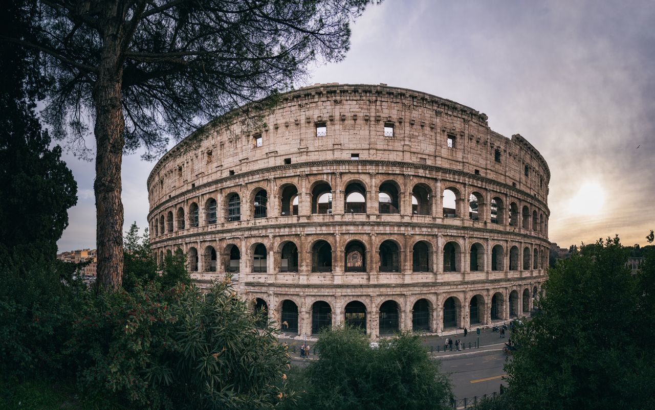 The Colosseum in Rome at sunset, a top historical stop on a Mediterranean cruise from Civitavecchia