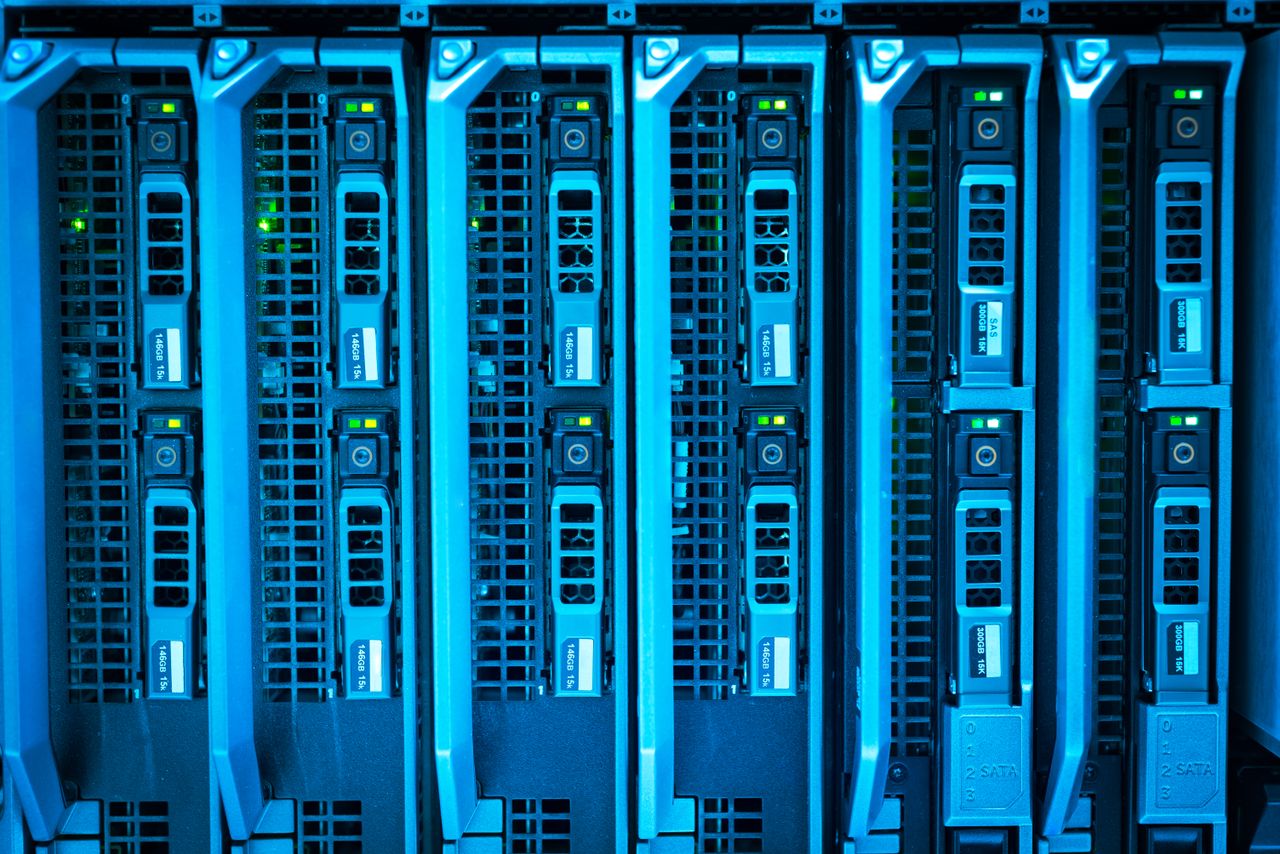 Illuminated server racks in a data center, similar to Liquid Web dedicated and VPS hosting hardware