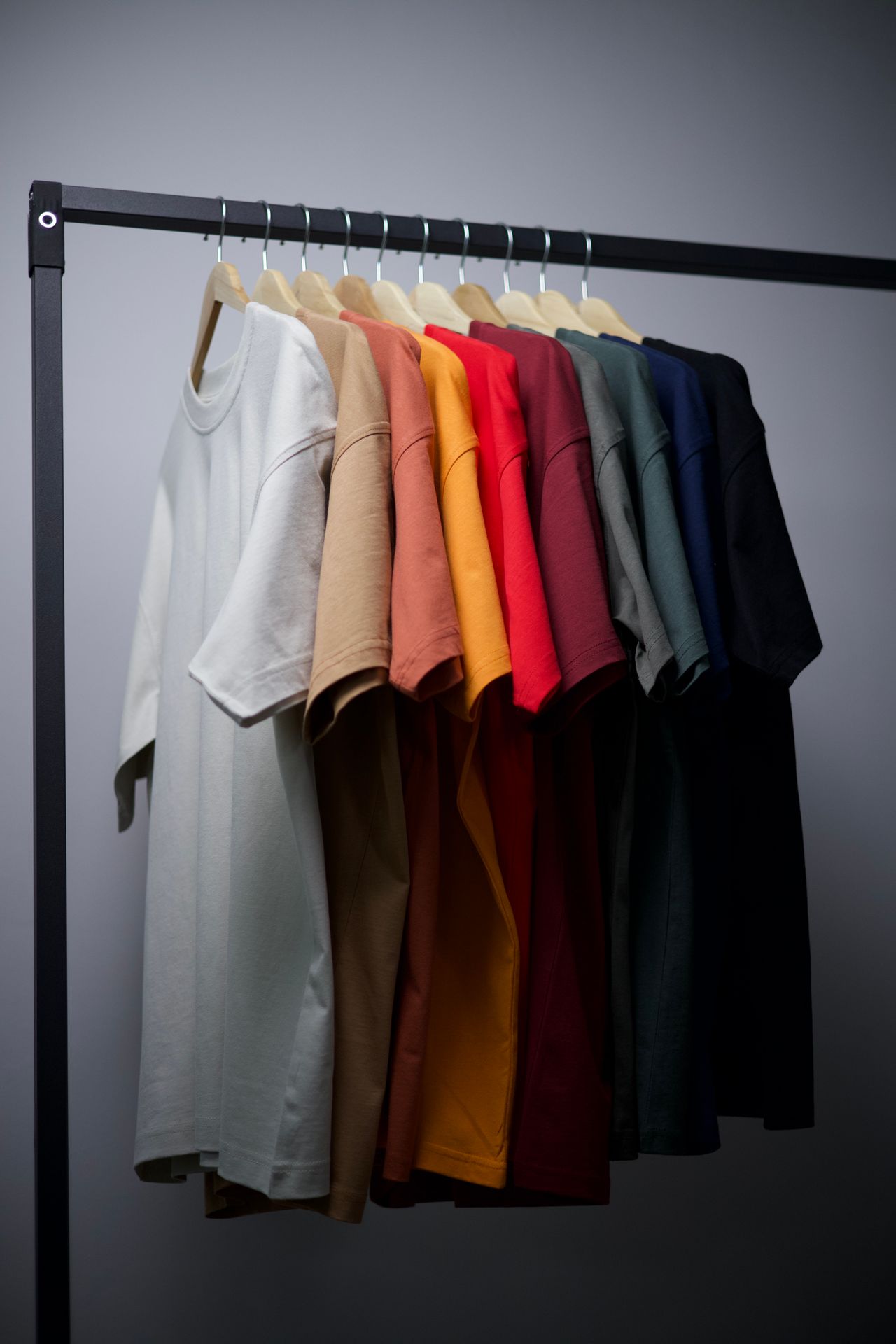 T-shirts on a rack ready to photograph for an online clothing store