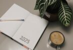 Open planner with coffee on a desk, planning how to start an online business