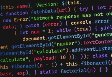 Colorful JavaScript code displayed on a screen, as written in an online JavaScript editor