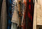 Rack of colorful men's casual shirts in plaid and stripes, ideas for colorful men's fashion