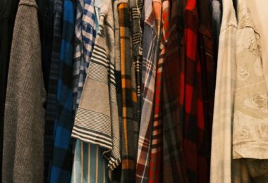 Rack of colorful men's casual shirts in plaid and stripes, ideas for colorful men's fashion