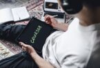 Person studying an online course on a tablet with headphones, for a Podia review of course selling