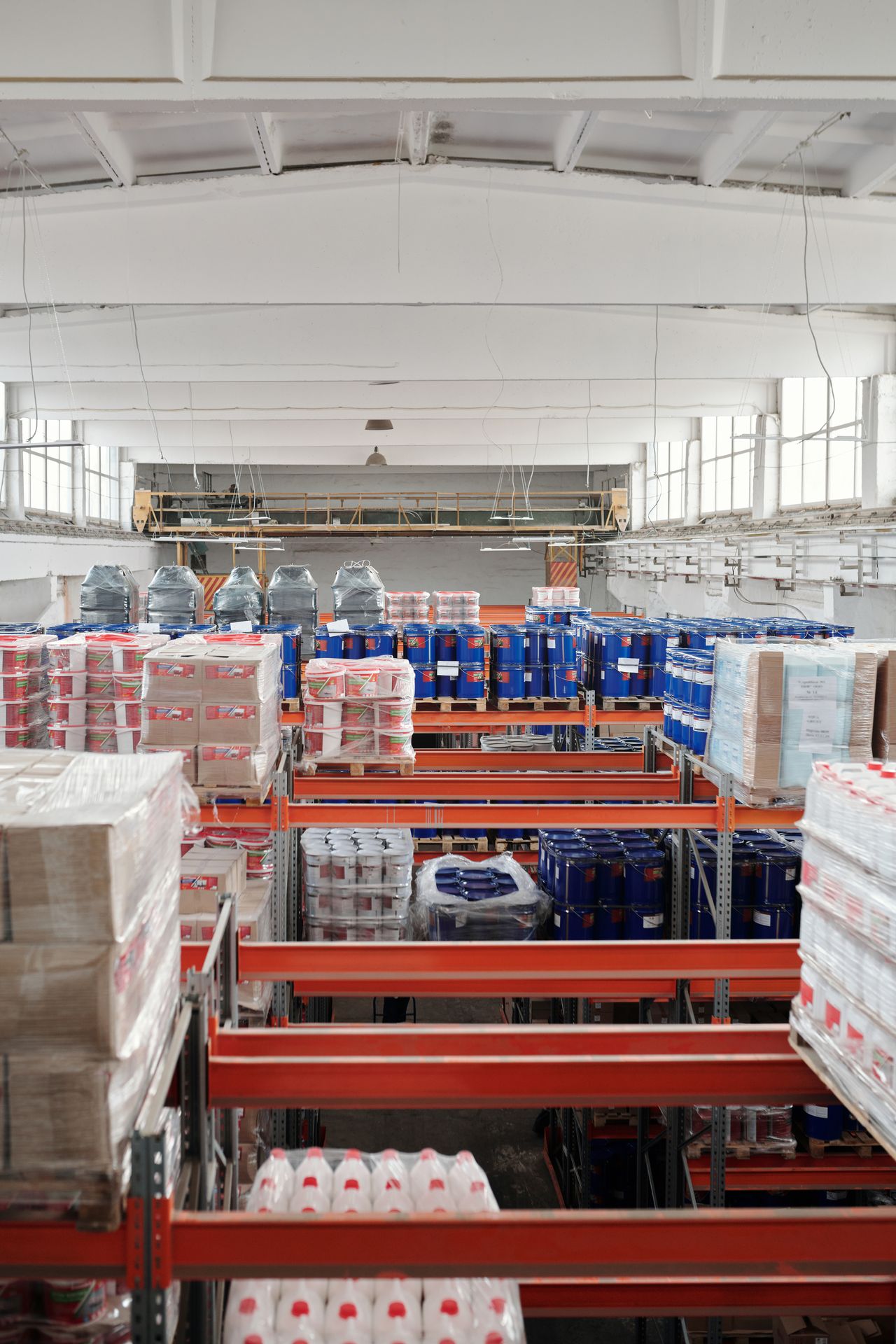 Large warehouse with goods on shelves, the kind of supplier stock behind a Wholesale2b dropshipping catalog