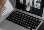 Laptop showing a group video call, like the webinars included in GetResponse plans reviewed for 2026