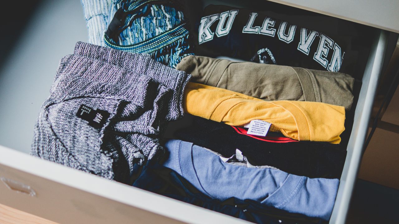 Folded shirts in assorted colors, sample stock for starting an online clothing store