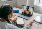 Student on a video call with a teacher on her laptop, one of many online jobs from home for students
