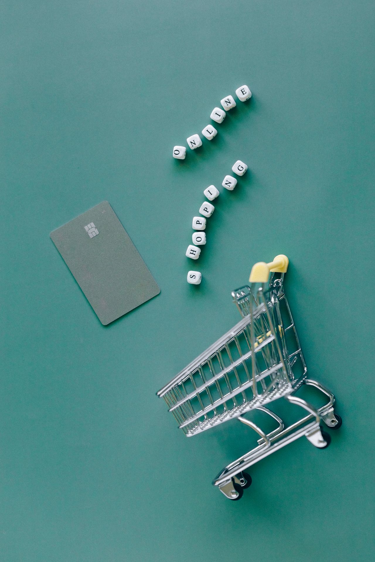 Mini shopping cart, credit card and letter blocks spelling online shopping, for UltraCart pricing