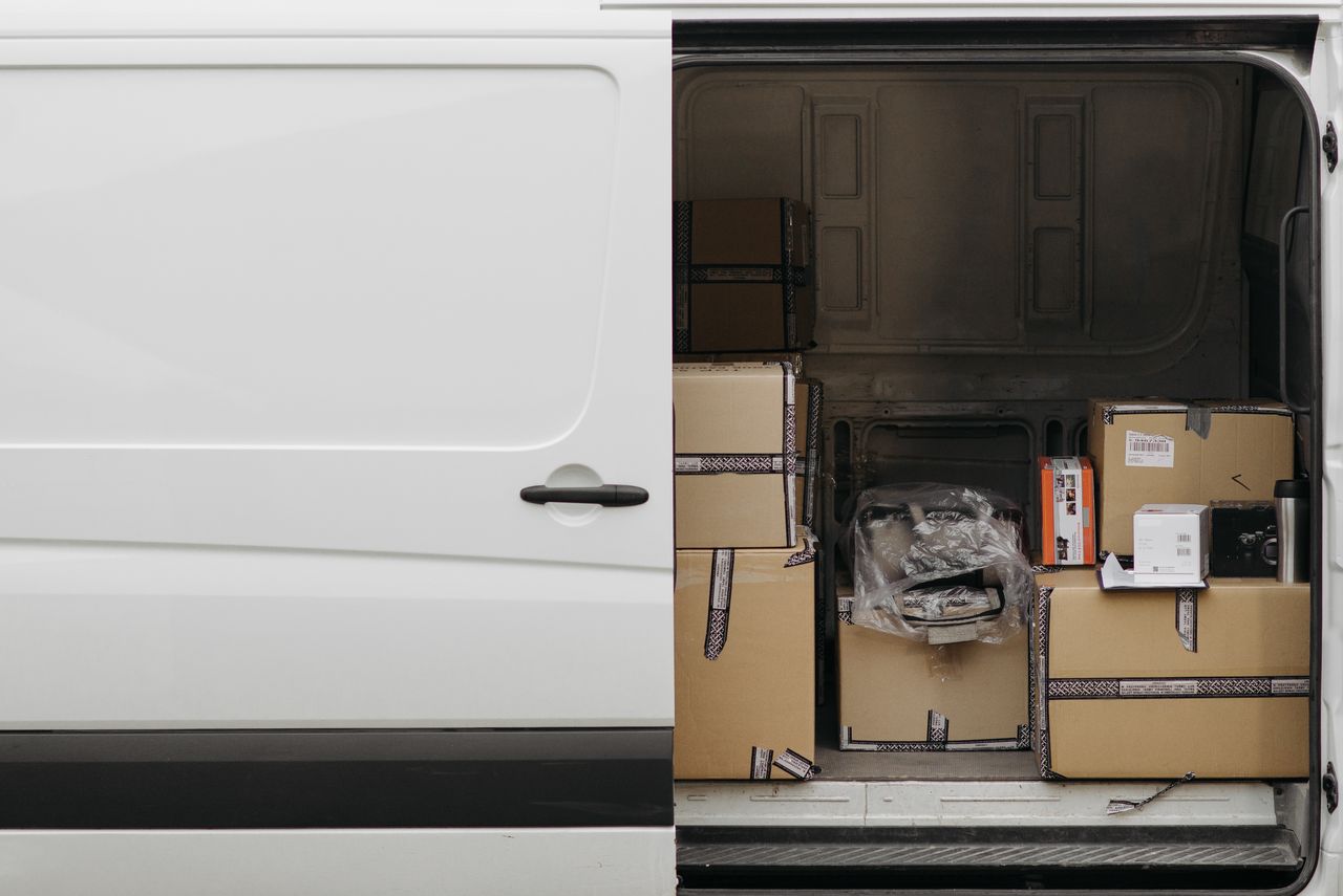 Delivery van loaded with boxes, showing how standard shipping parcels travel by ground