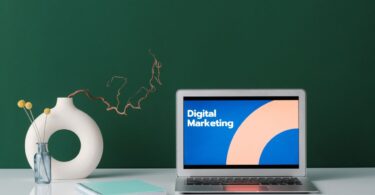 Laptop on a desk showing digital marketing, ready to learn how to use AWeber for email campaigns