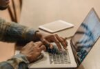 Freelancer working on a laptop at home, using top online earning sites to find paid work
