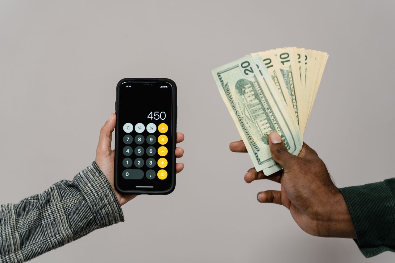 Counting money with a calculator to track real money made online