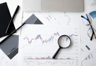 Magnifying glass on a document, symbolizing how to verify trusted online money making sites