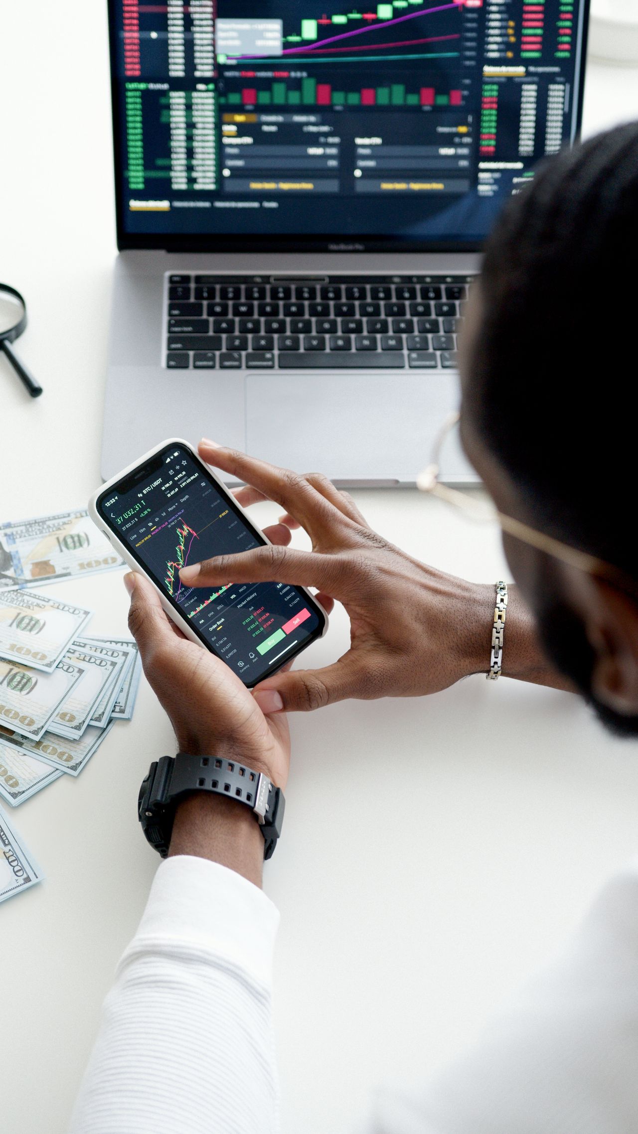 Investing app on a smartphone showing market data, a truly passive way to make money while you sleep