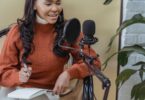 Creator recording a podcast with a microphone and laptop, the audience ConvertKit (now Kit) is built for