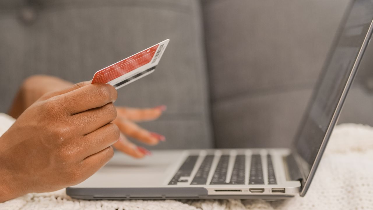 Close-up of a credit card purchase on a laptop, the kind of checkout page SamCart builds