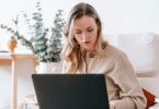 Busy freelancer working on a laptop at home using the best online earning websites