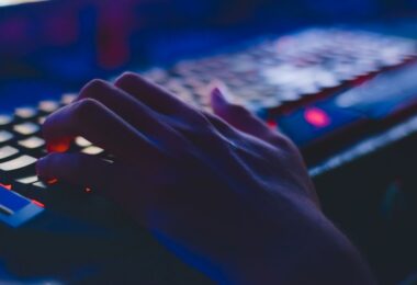 Person typing on a computer keyboard, doing data entry as online work to earn money