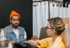 Customer paying by card at a fashion store counter, the in-store POS sales an EasyStore review covers