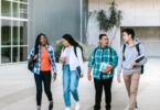 Group of college students walking on campus, where many online jobs for students start