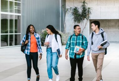 Group of college students walking on campus, where many online jobs for students start