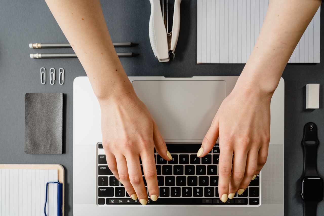 Person typing on a laptop at home, a common setup for online data entry work