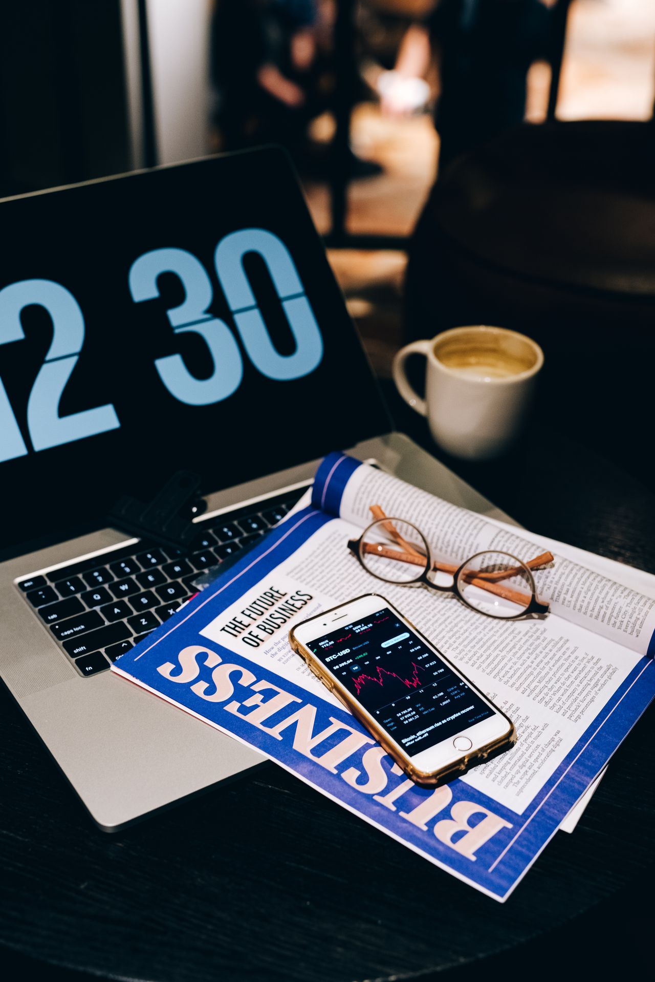 Laptop, smartphone and eyeglasses on a desk, ready to send a Kit (ConvertKit) newsletter