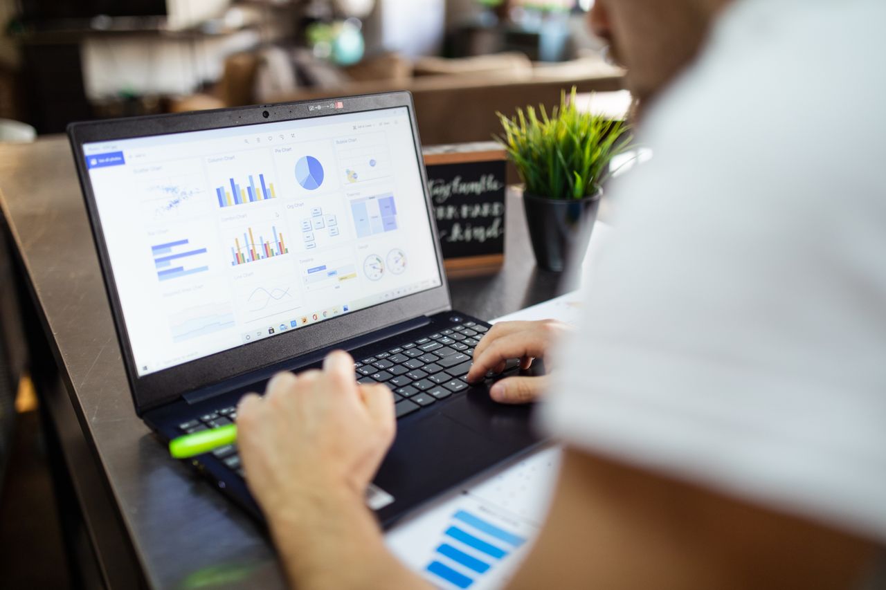 Charts and graphs on a laptop during research for marketing tools reviews
