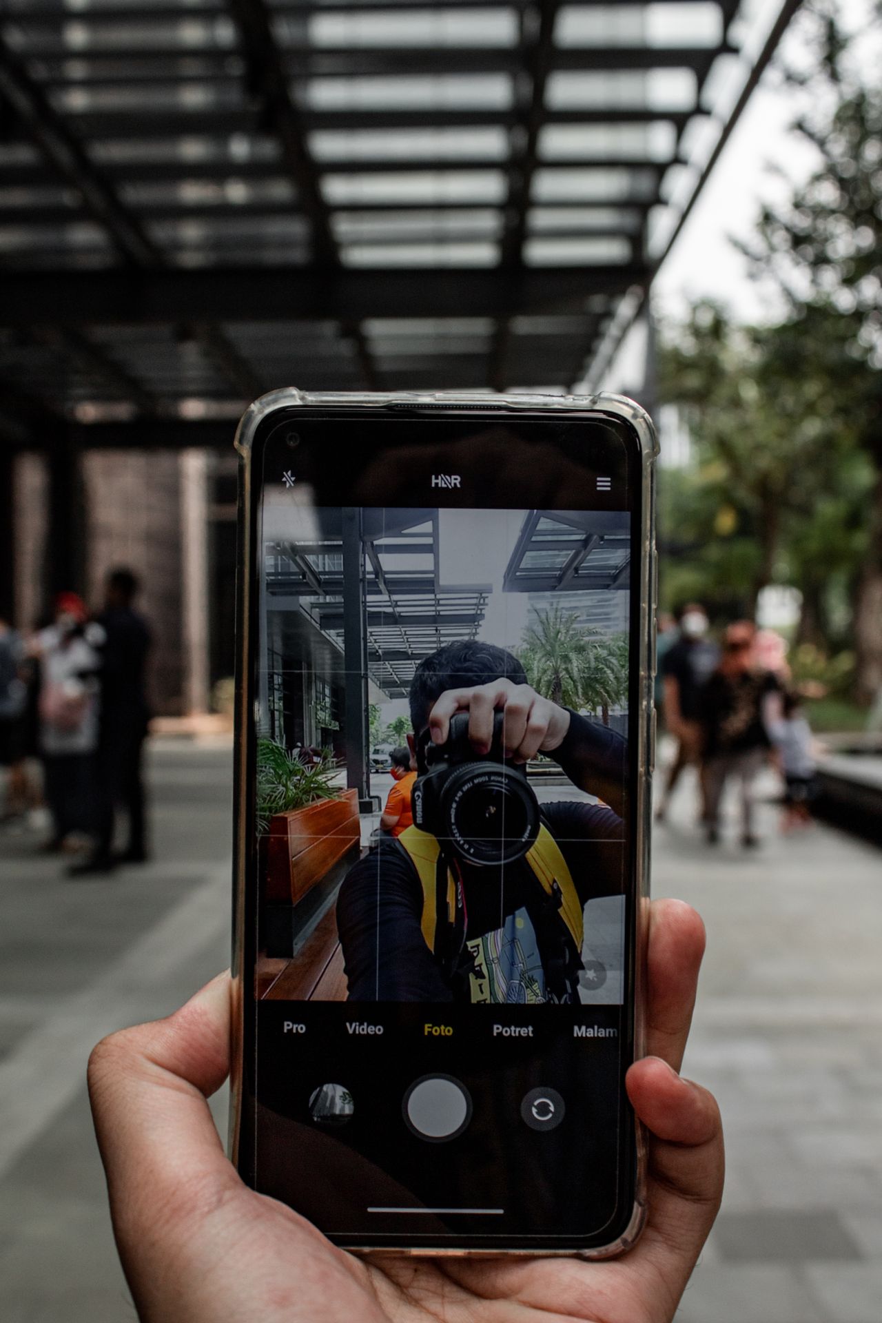 Smartphone capturing a city scene, keeping a full-quality original instead of using an Instagram photo downloader